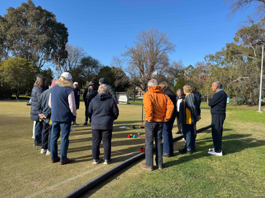 Kenn Boal provides instruction to referees in training